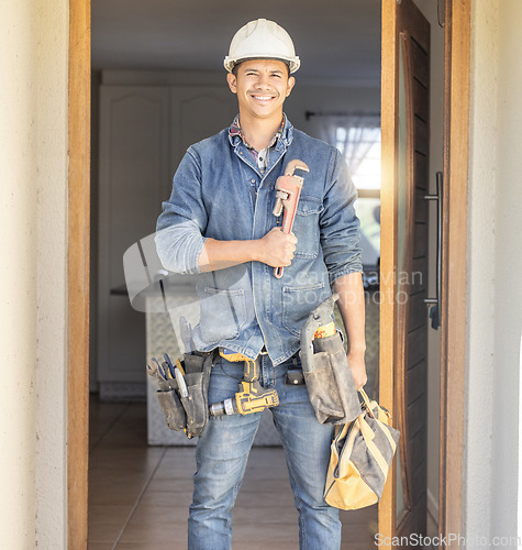 Image of Handyman smile in portrait, maintenance and tools with construction and home renovation with builder. Professional, contractor and DIY skills, architecture and wrench, male with helmet for safety