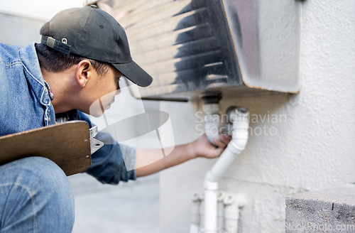 Image of Man, plumber and check faucet pipes for building maintenance, renovation and builder service. Handyman, pipeline and plumbing inspection for leak, drainage and installation of system, sink and repair