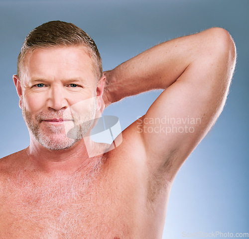 Image of Man, smile and armpit in skincare hygiene, grooming or feeling fresh against a studio background. Portrait of elderly male model smiling in satisfaction for shaving, hair removal or clean cosmetics