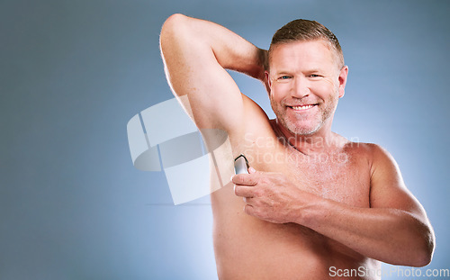 Image of Man, portrait smile and shaving armpit in skincare hygiene or grooming against a studio background. Elderly male model smiling in satisfaction for arm shave, hair removal or clean cosmetics on mockup