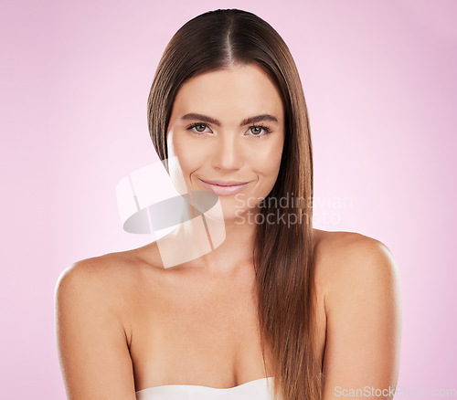 Image of Hair, beauty and woman, smile in portrait with haircare, skin and keratin treatment on pink background. Cosmetics shine, grooming and hairstyle, dandruff free with cosmetic care and female in makeup