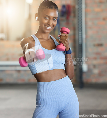 Image of Woman, fitness and portrait smile with dumbbells for weightlifting exercise, workout or strength training at gym. Happy female smiling for lightweights, exercising or healthy wellness at health club