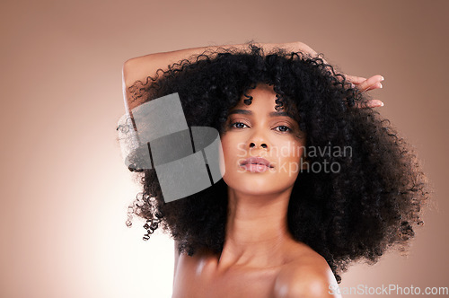 Image of Beauty, hair and portrait of black woman in studio for self care with shampoo for growth. Aesthetic model with natural curly afro with cosmetics, skincare glow and face makeup on gradient background
