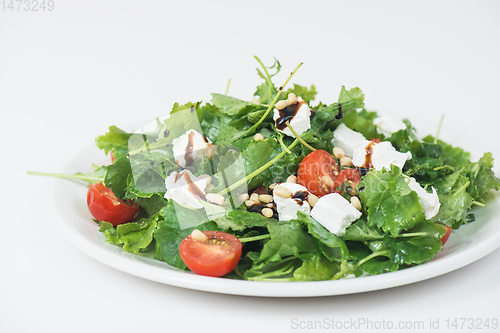 Image of Green salad with vegetables and cheese