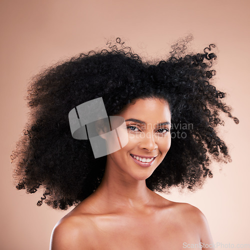 Image of Happy black woman, portrait or afro hair on studio background in aesthetic empowerment, curly texture pride or skincare glow. Beauty model face, smile or natural hairstyle and makeup on isolated wall