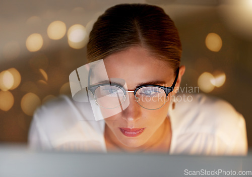 Image of Business woman, face and reading on computer, focus and working, editor and research with bokeh overlay. Female in office, data analysis and check article for blog or read email, review for feedback