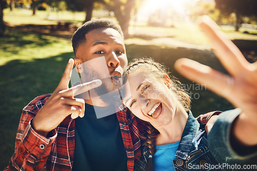 Image of Couple smile, selfie peace sign and portrait outdoors, laughing at funny joke and bonding in nature. Diversity, love romance and black man and woman with v hand emoji to take photo for happy memory.