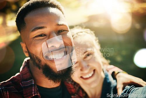 Image of Couple, love selfie and portrait smile at park outdoors, enjoying fun time and bonding together. Diversity, romance and face of black man and woman taking pictures for happy memory or social media.