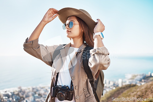 Image of Travel, photographer and woman with camera in nature, happy and relax on adventure on blue sky background. Freedom, photography and girl student backpacking, sightseeing and solo trip in South Africa