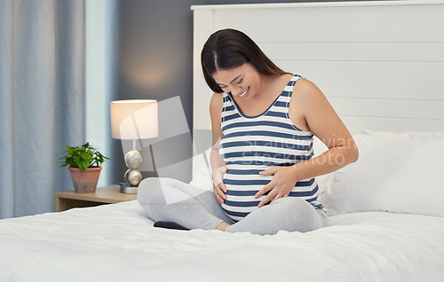 Image of Pregnant stomach, woman and home bedroom while happy about bonding and growth. Mother to be person with hands on abdomen for healthy pregnancy development, body wellness and care or love on her bed