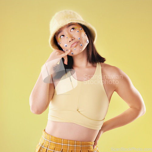 Image of Fashion and woman with a hand call isolated on a yellow background in a studio. Idea, thinking and Asian girl with fingers in a telephone gesture for communication, conversation and talking
