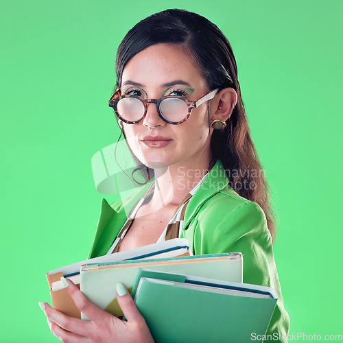 Image of Beauty, books and portrait of a woman in studio with glasses for teaching or education. Fashion, serious and female teacher with spectacles carrying textbooks for class isolated by green background.