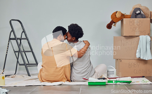 Image of Forehead, floor or black couple love home renovation, diy or house remodel a wall together. Back view, painting or African man with a happy woman planning or hugging with teamwork in partnership