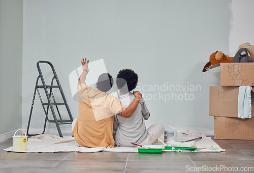 Image of Planning, wall or black couple pointing in home renovation, diy or house remodel together on floor. Back view, painting or African man loves talking or working with teamwork in decoration with woman