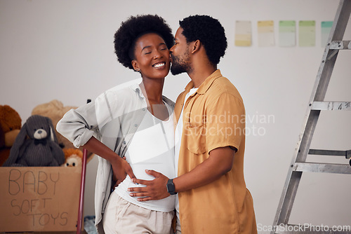 Image of Love, pregnancy or black couple kiss in home renovation, diy or house remodel together by apartment ladder. Hugging, happy smile or African man and pregnant woman excited about baby or new family