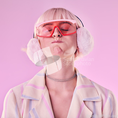 Image of Fashion, woman and quirky on a pink background in studio with funny glasses for cyberpunk style. Face of edgy, trendy or retro aesthetic person with vaporwave, creativity and art color clothes