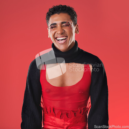 Image of LGBTQ, fashion portrait and black man isolated on red background for creative cosmetics, makeup and queer lifestyle. Young, edgy gen z model or gay person headshot for beauty and art design in studio