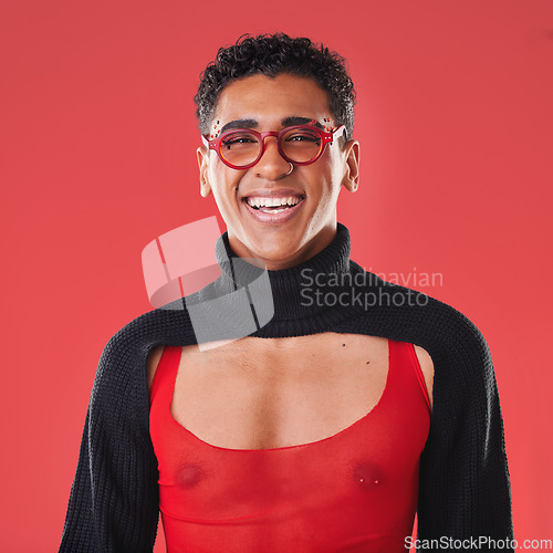 Image of LGBTQ, queer and portrait of a gay man with unique fashion and style isolated against a studio red background. Transgender, homosexual and trendy nonbinary and gen z person happy in clothes