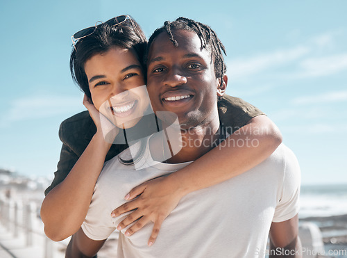 Image of Happy couple, portrait and piggyback by beach in relax romance holiday, love vacation date or summer travel location. Smile, bonding and man carrying black woman in fun game, freedom trust or support