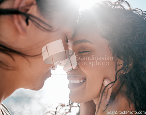 Image of Face, love and nature with a couple together at the beach, sharing an intimate moment outdoor closeup. Trust, travel or relax with a young man and woman enjoying a romantic date bonding in summer