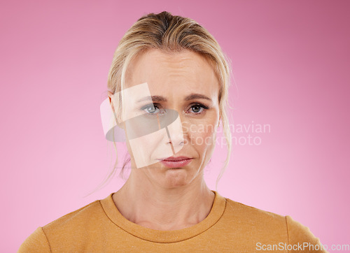 Image of Portrait, woman and sad with mental health, depression and lady against studio background. Face, mature female and stress with anxiety, fatigue and suffering from loneliness, anxious and problems