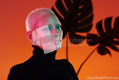 Image of Face portrait, beauty and skincare of woman in studio isolated on red plant background. Neon aesthetic, makeup cosmetics and gen z model with glowing, healthy and flawless skin after spa treatment.