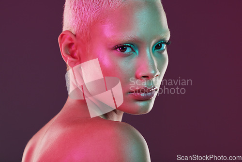 Image of Neon, beauty and cyberpunk, portrait of woman with makeup and lights for creative or unique skincare on studio background. Skin care, art and cosmetics girl, model isolated for futuristic face mockup