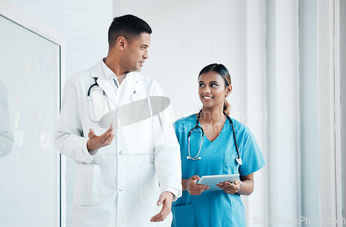 Image of Doctor, nurse and professionals walking, talking and planning healthcare surgery in a hospital together as medical experts. Medicine, tablet and colleagues in discussion as a team working in a clinic