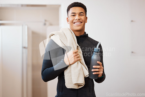 Image of Portrait, black man and bottle in locker room of gym for rest, cleaning towel and shower after exercise. Happy sports guy, athlete and break after workout, training and wellness in fitness bathroom