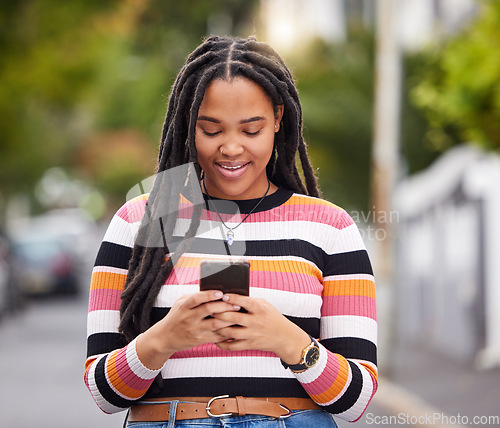 Image of Black woman with phone in city, happy outdoor with technology, chat and communication, travel and fashion. Social media, urban street and adventure with female, connectivity and 5g in Jamaica