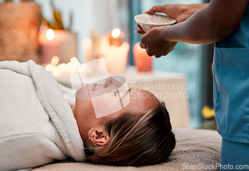 Image of Beauty, skincare and woman getting a face massage with oil for self care, cosmetic and self care. Health, spa and female doing a luxury facial treatment for glowing and healthy skin by wellness salon