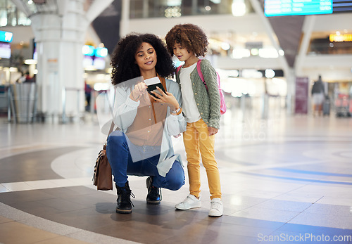 Image of Travel, passport and mother with her child in the airport checking their boarding pass together. Trip, technology and woman browsing on a cellphone with girl kid while waiting for flight in terminal.