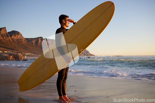 Image of Surfer, man and beach with looking, waves and hand by eyes for safety from sun, thinking or planning morning. Ocean athlete, surfboard or water for fitness, sports and tropical adventure for exercise