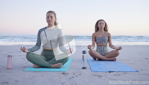 Image of Yoga, meditation and zen with woman friends on the beach for fitness, mental health or wellness. Training, exercise or chakra with female and personal trainer meditating legs crossed on the sand