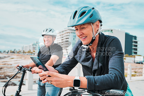 Image of Travel, bike and senior people on a phone for fitness health app, cardio exercise progress and 5g network. Happy woman and partner or friends in lose weight journey on electric bicycle and smartphone