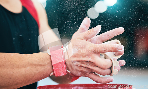 Image of Hands, fitness and gymnast with powder grip in stadium for sports, workout or exercise. Night gymnastics, training and man or athlete with chalk dust to start performance, competition or exercising.