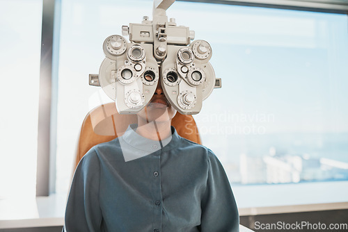 Image of Optometry test, eye exam and black woman in clinic for testing, eyesight and optical assessment. Healthcare, optometrist consultation and patient with medical equipment, phoropter and lens for eyes