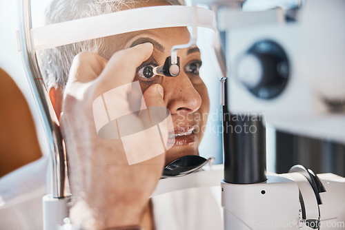 Image of Senior eye zoom, retina check and medical eyes test of elderly woman at doctor consultation. Vision, healthcare focus and old female patient with consulting wellness expert for lens and glaucoma exam