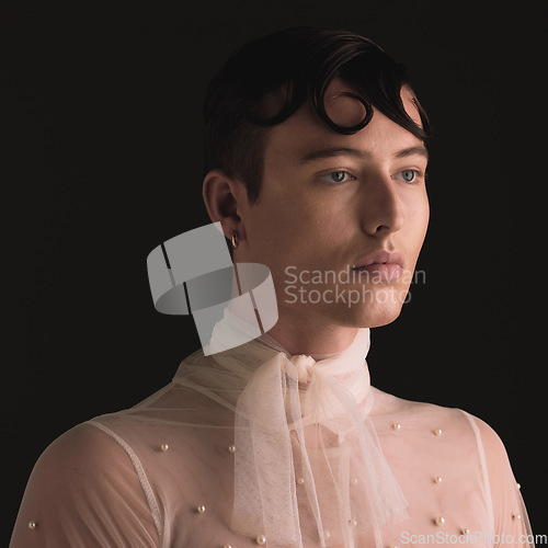 Image of Gender neutral, fashion face and vintage aesthetic with designer clothing and faux pearls in studio. Isolated, black background and lgbtq or gay gen z with jewelry and creativity and non binary art