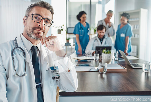 Image of Healthcare, confidence and portrait of senior doctor at desk in hospital for support, teaching and medical students. Health, medicine and leadership confident, mature and mentor, man with stethoscope