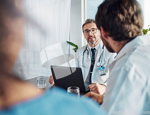 Image of Doctors, teamwork or research on laptop for health, medicine or healthcare innovation planning, collaboration or consulting in hospital. Computer, nurses or meeting for medical surgery strategy