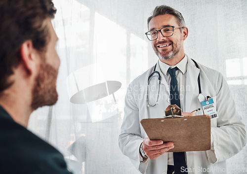 Image of Senior doctor, patient data and results of a hospital worker in a cardiology consultation. Happiness, working and checklist clipboard of a wellness and health employee with a smile in a clinic