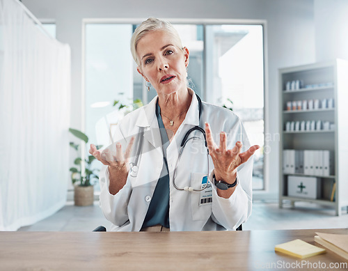 Image of Senior woman, doctor and video call in hospital for online consultation and telehealth. Portrait, healthcare and female medical physician consulting or asking question in virtual meeting for wellness