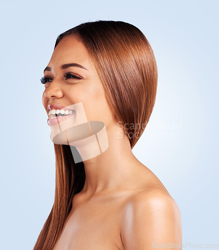 Image of Face, skincare and hair care of woman in studio isolated on a blue background. Makeup cosmetics, thinking beauty and laughing funny female model with salon treatment for growth, texture and balayage.