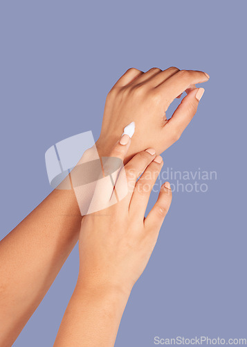 Image of Hands, skincare and cream cosmetics in studio isolated on a purple background for hydration. Product, dermatology and woman or female model with lotion, creme or moisturizer for beauty aesthetics.