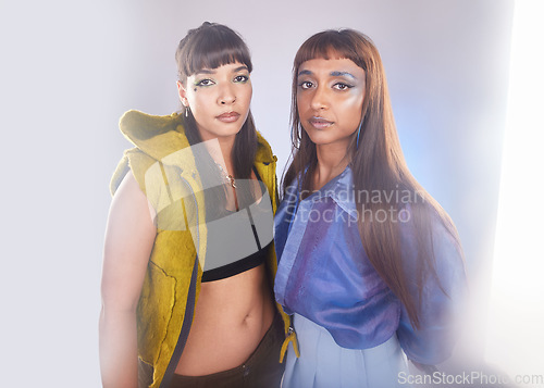 Image of Fashion portrait, makeup and couple of friends isolated on studio background in beauty, art and neon aesthetic. Cyberpunk, edgy cosmetics and model, diversity women or gen z people in creative studio