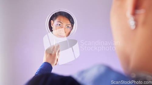 Image of Makeup, reflection and gay man with mirror in hand with pride on purple background. Cosmetics, aesthetic and art, lgbt fashion model face with beauty in studio, non binary and gender neutral skincare