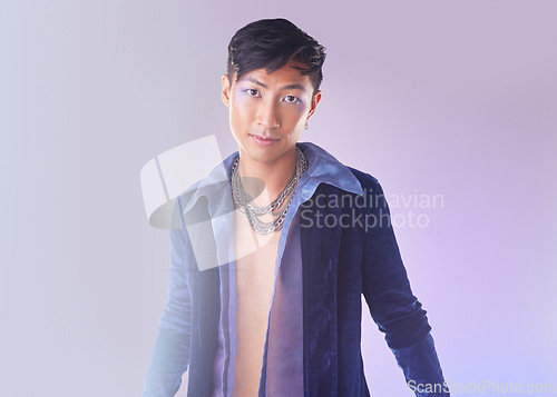 Image of Art, makeup and lgbt portrait of man in Indonesia, gen z person isolated on purple background. Style, aesthetic and fashion model with beauty in studio, creative non binary and gender neutral design.