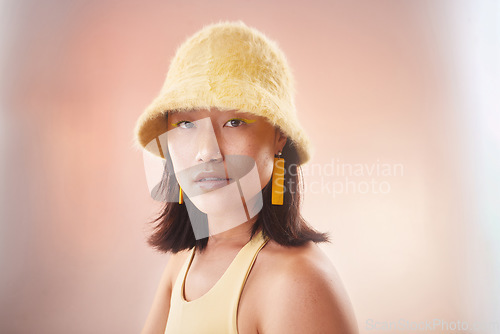 Image of Asian woman, fashion and cosmetics with gen z and portrait, yellow aesthetic and edgy on studio background. Streetwear, beauty and makeup with style, female face and mockup space with fog or smoke