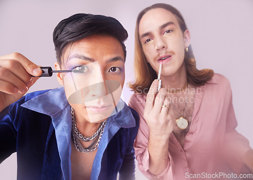 Image of Man, gay and mascara makeup in studio with gen z friends, beauty and cosmetics for fashion by background. Lgbtq couple, cosmetic or portrait for vintage 80s aesthetic with support, solidarity or eyes